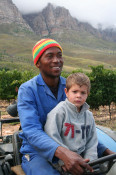 Samuel, from Lesotho, drives the gondola-pulling tractor, while Anton's youngest son, Antonie, learns the business first hand. The three year old seemed right at home.