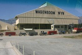 Literally, "Wagenboom Wyn" translates to WagonTree Wine; the name of our local wine cooperative is Waboomsrivier, or Wagontree River. Direct wine marketing is not their thing: 98% of the wine is sold in bulk to other wineries and wine marketing companies. Once the loads of grapes have been weighted, then they line up for sugar testing, and then ultimately for dumping into the winery's crushing and destemming machinery.