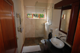 The clean, modern bathroom with roomy shower will make waking up in the Kingsbury Cottage a delight...