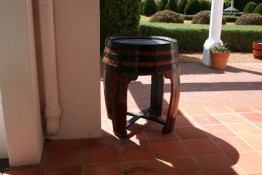 Check out this creative use of an old wine barrel. Morgenhof is not the only outift to think of an alternative other to making a planter box out of a used barrel. Gary Doty, a good friend of the Silkbush family in Kenwood, California (Sonoma Winey Country), has been making all sorts of nifty furniture, including wine racks and tables, from barrels for some years. The craftsmanship on both continents is quite high and we really admire the end products.