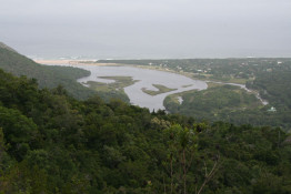The Tsitsikamma National Park is an 80 kilometer stretch of untouched coastline, and the "Garden" of the Garden Route. Carved out of the parklands is this idyllic beach and cottage area, known generically as De Vasselot, Clinton's Bank, and Klipriviermond. The Tsitsikamma National Park is a protected area and well-known coastal reserve for its indigenous forests & dramatic coastline. Nature's Valley is at the western end of the park, and the main accommodation is at Storms River Mouth. Near the park is the Bloukrans Bridge, the world's highest bungee jump at 216 metres (709 ft). The word "Tsitsikamma" hails from the Khoekhoe language tse-tsesa, meaning "clear", and gami, meaning "water", probably referring to the clear water of the Tsitsikamma River.