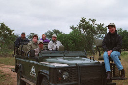 At most camps, the Range Rovers leave at 6-6:30 AM for three hours, and then again at 4:00 PM for another three hours. Normally, a local native tracker sits on the front as the "hood ornament," but in this posed photo, Julie Parsons, an Australian guest, took the lead seat. (She probably would not have been as eager to be in this position when we got "up close and personal" with the lion prides.)