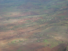 The deeply eroded gullies seen in this photo are generally known in Africa as "dongas." Subsistence farming of shallow soils, coupled with rainstorms, can result in major loss of first topsoil, and then a goodly portion of the tillable terrain itself. Truly a pity.