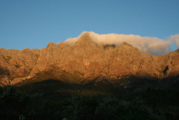 With mountain vistas to both our east and west, sunsets are sometimes enjoyed simultaneously and in differing colors. This one was reminiscent of Table Mountain (with its "table cloth" cloud) and the shadows of mountains to the west creeping over us. When conditions are right, it simply takes your breath away.